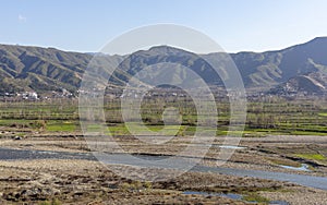 Beautiful scenic view of a river and fields in winter