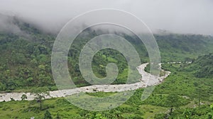 Beautiful scenic view from Samsing View Point, Dooars. Murti river and tea garden on the vally of Himalayan mountain.