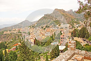 Beautiful Scenic View of Taormina`s Old Town. Terracotta Old Ancient City Houses with Tiled Roofs. The island of Sicily, Italy