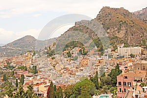 Beautiful Scenic View of Taormina`s Old Town. Terracotta Old Ancient City Houses with Tiled Roofs. The island of Sicily, Italy