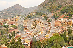 Beautiful Scenic View of Taormina`s Old Town. Terracotta Old Ancient City Houses with Tiled Roofs. The island of Sicily, Italy