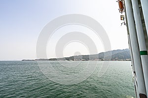 Beautiful scenic of village port at Miyajima Island from local ferry boat