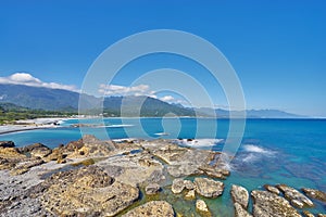 Beautiful scenics of rocky coastline beach at Sanxiantai in Chenggong city photo