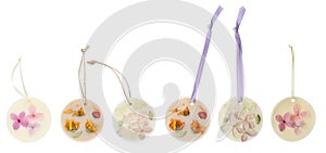 Beautiful scented sachets with dried flowers on white background, collage. Banner design