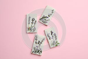 Beautiful scented sachets with flowers on pink background