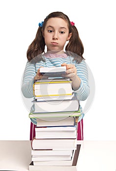 Beautiful school girl with a lot of books