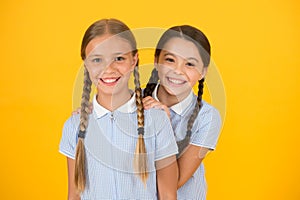 Beautiful schoolgirls. Back to school concept. Cute schoolgirls. Girls with braided hair style. Hairdresser salon