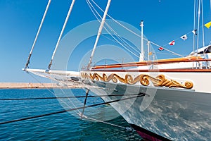 Beautiful schooner with golden patterns sailing in the ocean
