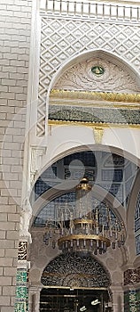 Beautiful scriptures engraved above the main door leading to our beloved Prophet