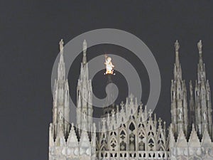 Beautiful sculpture on The Duomo (or Cathedral) of Milan at night.