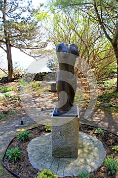 Beautiful sculpture of semi-nude woman's body,set in peaceful garden,Ogunquit Museum of American Art,Maine,2016