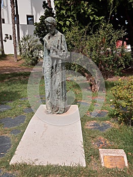 beautiful sculpture of the Sephardic poet and philosopher Salomon Ben Gabirol in the Spanish city of Malaga on a summer day