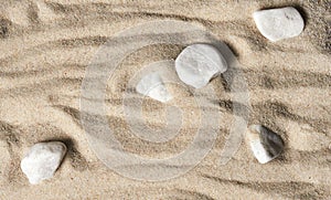 Beautiful sea background. yellow sand with white stones