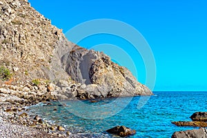 Beautiful sea bay among the rocks on a sunny summer day