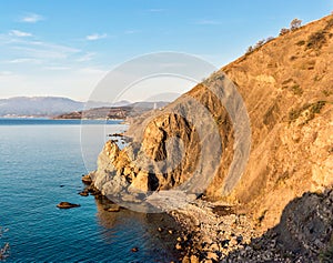 Beautiful sea bay among the rocks on a sunny summer morning