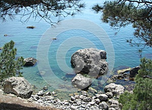 Beautiful Sea beach overlooking the blue water and large stones. Black sea. Crimea