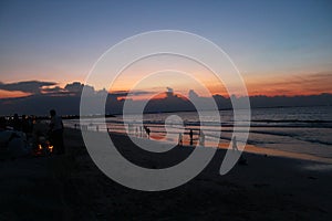 Beautiful sea beach sunrise sunset colorful sky view people walking