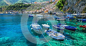 Beautiful sea and places of Calabria -Scilla town with traditional fishing boats. south of Italy photo