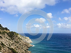 Beautiful sea and rocks vew over horizon in Cala Llonga bay, Me