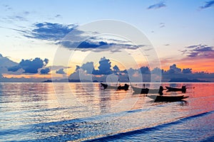 Beautiful sea sunset, ocean sunrise, tropical island beach landscape, blue water waves, fisherman boat, ship silhouette, colorful