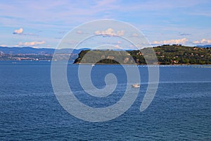 Beautiful sea view with a boat of old town Piran on Adriatic Sea in Slovenia, Europe