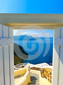 Beautiful sea view from the open gate. Santorini island, Greece.