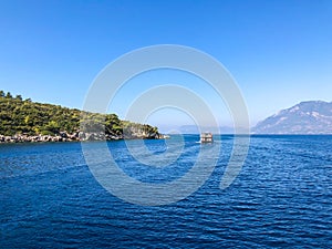 Beautiful sea view, sailboats far away in the sea in sunny day, natural background, amazing summer adventure