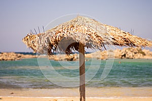 A beach umbrella blown by the wind photo