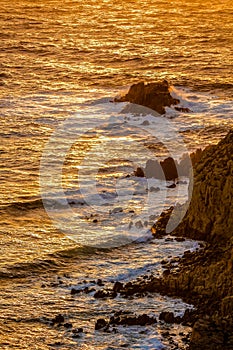 Beautiful sea wave crashing on rock coast