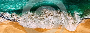 Beautiful sea wave at sunset from a bird`s eye view. Beautiful lonely beach at sunset.