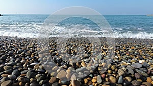 Beautiful sea waves, pebble beach.