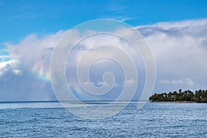 Beautiful seacape showing a stunning rainbow cloud over the waters near Lahaina.
