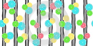 Beautiful seamless pattern with yellow, green, blue and pink citrus fruits on a black and white striped background