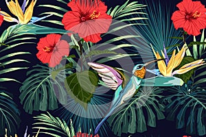 Beautiful seamless vector floral summer pattern background with hummingbird, exotic flowers and palm leaves.