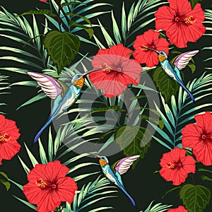 Beautiful seamless vector floral summer pattern background with hummingbird, red hibiscus flowers and palm leaves.