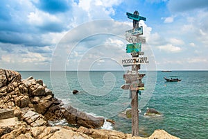 Beautiful seascape. Ancient pointer distances in different directions, by the sea