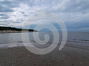 Beautiful seascape, calm water and beautiful cloud reflections in water