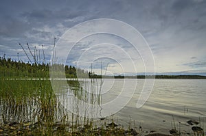 Beautiful seascape in Holmon island with water ripple and cloud passing by the coastline during a stunning day