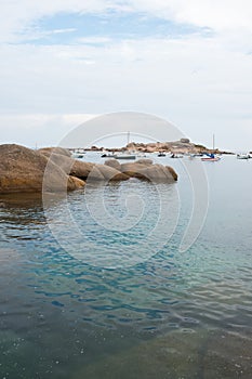 Beautiful seascape with rocks and clear water. Pink granit coast in France