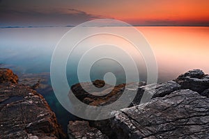 Beautiful seascape. Sea and rock at the sunset