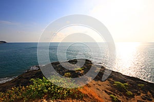 Beautiful seascape with sky twilight of sunset and sea horizon with Calm and blue sky.Dry grass field on mountain of Phrom Thep