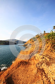 Beautiful seascape with sky twilight of sunset and sea horizon with Calm and blue sky.Dry grass field on mountain of Phrom Thep