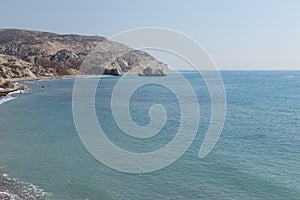 Beautiful seascape. Travel concept. Seascape on the background of the wild rocky coast. Wild beach, azure water and rocks