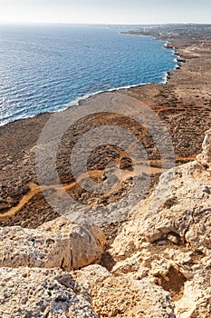 Beautiful seascape. Travel concept. Seascape on the background of the wild rocky coast. Wild beach, azure water and rocks