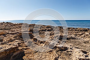 Beautiful seascape. Travel concept. Seascape on the background of the wild rocky coast. Wild beach, azure water and rocks. Luxury