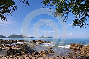 Beautiful seascape view at Kalim beach near Patong beach with rocks in the foreground in Phuket Thailand