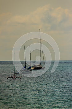 Beautiful seascape view of Nai Harn Beach Phuket with sail yacht