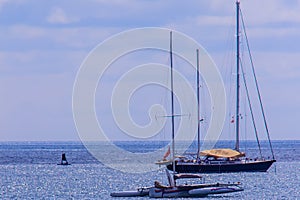 Beautiful seascape view of Nai Harn Beach Phuket with sail yacht