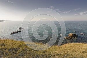 Beautiful seascape with a view of a trabucco at sunset