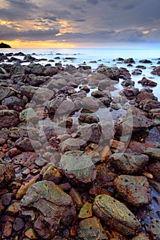 Beautiful seascape of wave and rock when the sunset